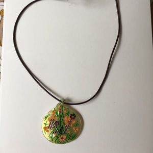 Painted and embellished necklace.